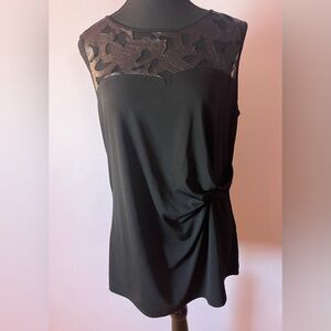 Ricki’s black sleeveless top with pattern Size L
